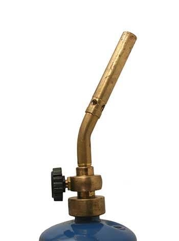 A brass torch valve fitted to the top of a gas cylinder
