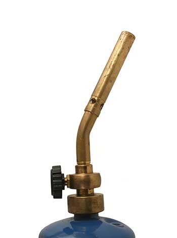 A brass torch valve fitted to the top of a gas cylinder